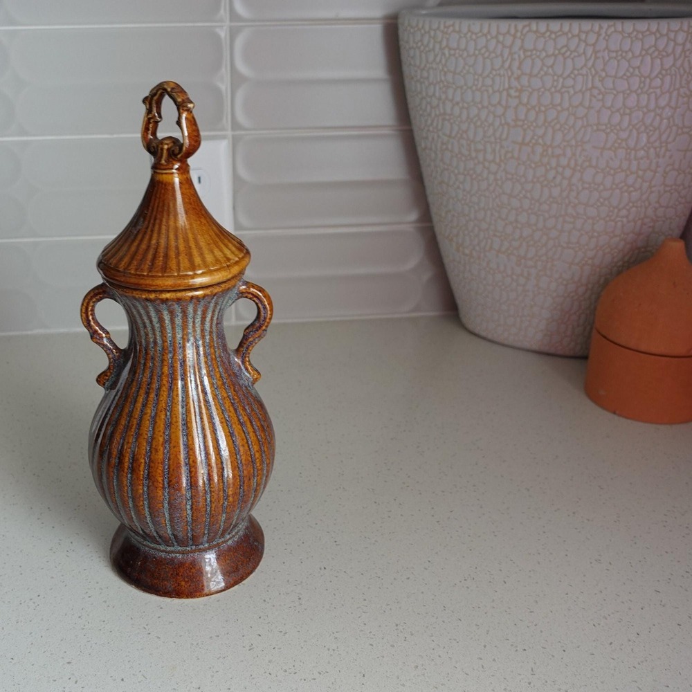 Vintage Ceramic brown bottle with twist on lid‎